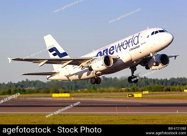 A Finnair Airbus A319 with the registration OH-LVD in the OneWorld special livery takes off from Helsinki Airport (HEL) in Finland
