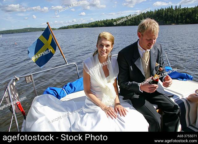 Wedding. The bride and groom go by boat to the party and celebrate with champagne