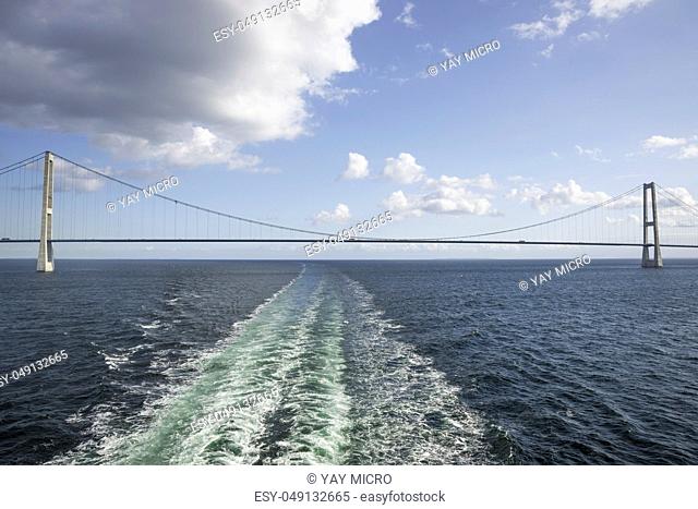crossing the Suspension bridge Great Belt Denmark connecting the Zealand and Funen with a boat