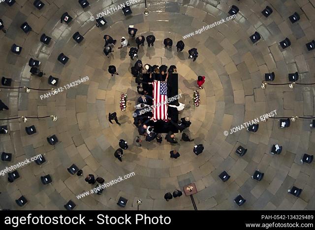 Members of Congress and the Congressional Black Caucus form a circle around the casket of civil rights pioneer and longtime United States Representative John...