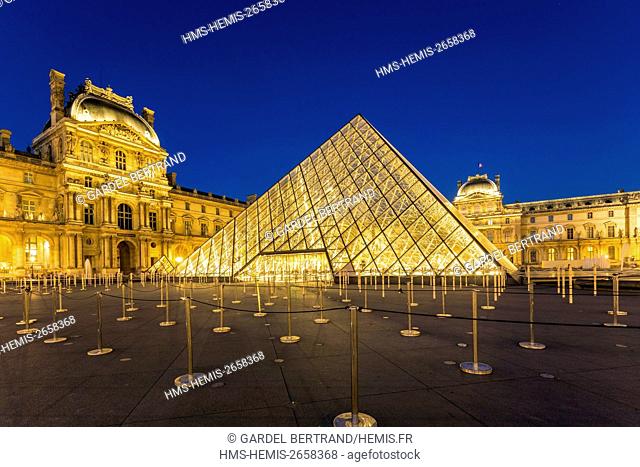 France, Paris, area listed as World Heritage by UNESCO, the Louvre Pyramid by the architect IM Pei and facade of the Cour Napoleon