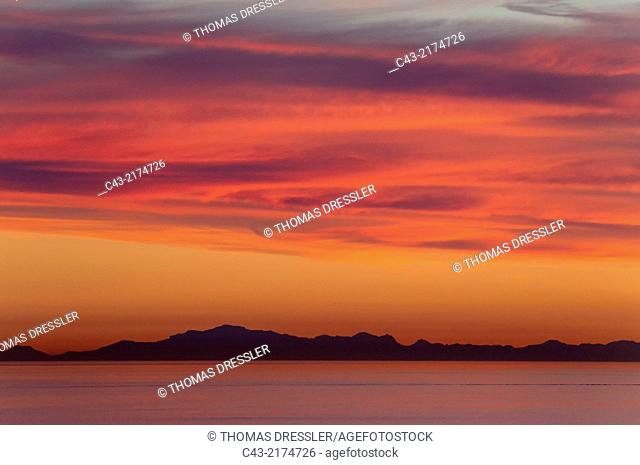 The Mediterranean Sea and the Moroccon coastline with the Rif Mountains. With stratocumulus clouds in sunset light. Seen from Marbella, Costa del Sol