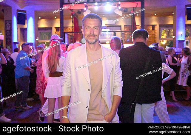 26 June 2023, Bavaria, Munich: Actor Wayne Carpendale celebrates at the UFA reception at Munich's Park Café. The film production company celebrated with many...