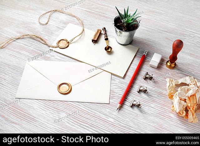 Old blank retro stationery on light wooden background