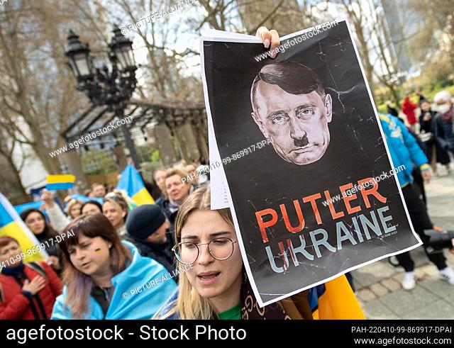 10 April 2022, Hessen, Frankfurt/Main: ""Putler Ukraine"" is written on the poster under a head, which is supposed to represent a mixture of Hitler and Putin