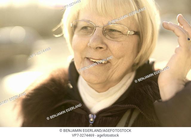 upbeat senior woman searching for idea, positiveness, in Cottbus, Brandenburg, Germany