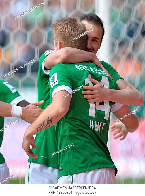 Bremen's Aaron Hunt celebrates his 1-0 goal with teammate Theodor Santiago Garcia (BACK) during the Bundesliga soccer match between Werder Bremen and Hertha BSC...