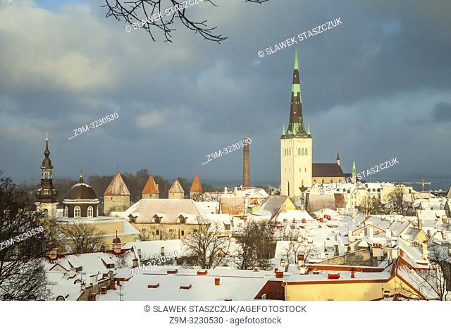 Winter day in Tallinn old town, Estonia. St Olaf's church dominates the city skyline