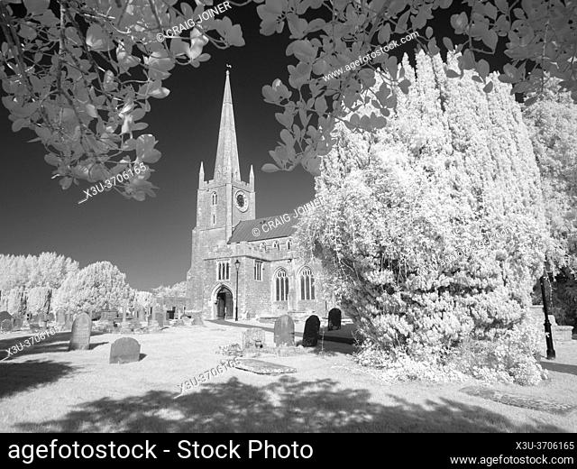 A black and white infrared image of St Andrews Church at Congresbury, North Somerset, England