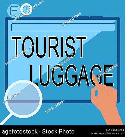 Text sign showing Tourist Luggage, Internet Concept big bag that contains everything one needs for traveling Hand Using Big Tablet Searching Plans For New...