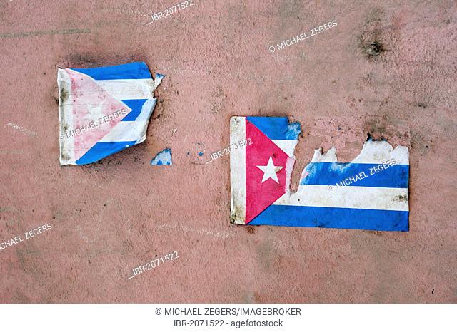 Pink wall with paper stickers of the national flag, Havana, Habana, Cuba, Greater Antilles, Caribbean, Central America, America