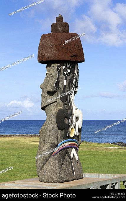 Souvenirs are sold outside the city of Hanga Roa. Moai on Easter Island, Rapa Nui, at Ahu Tahai. The only moai that has coral eyes left