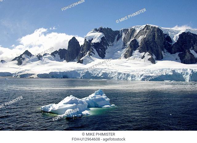 Spigot Peak, Arctowski Peninsula, Antarctica Iceberg in foreground