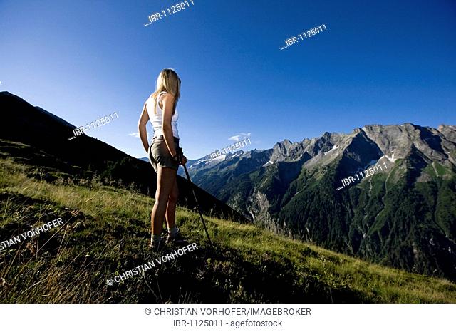 Hiker looking at the mountains, Zillertal Alps, Mayerhofen, North Tyrol, Austria, Europe