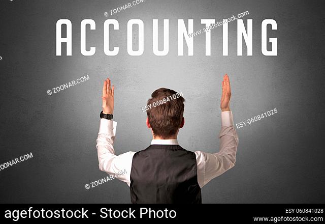 Rear view of a businessman with ACCOUNTING inscription, powerfull business concept