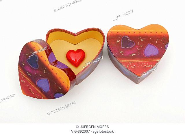 07.02.2007, Germany: two large gift boxes in heart form and a small red heart inside, on white background, symbol picture love. - GERMANY, 07/02/2007