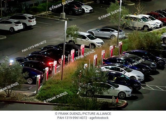 Teslas charging at the Supercharger at the Qualcomm parking lot in Sorrento Valley, where many high tech, biotech, and IT companies are located, in Febuary 2018