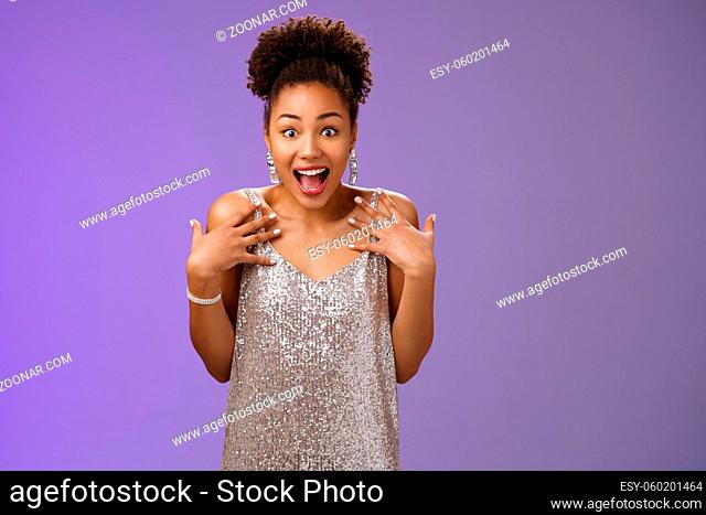 Amazed surprised attractive african-american young woman in glittering evening night dress scream happiness pointing herself amused cannot believe lucky win...
