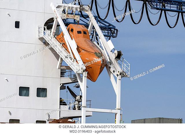 Rotterdam, Netherlands - April 17, 2018: An Unsinkable, totally enclosed, free-fall lifeboat made of plastic, on angled launch platform at the rear of a cargo...