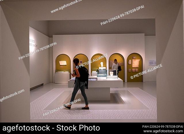 24 June 2022, Rhineland-Palatinate, Trier: A woman walks through an exhibition room at the Rhenish State Museum in Trier during a press tour of the state...
