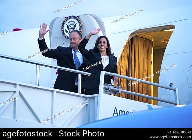 United States Vice President Kamala Harris, right, and her husband, Doug Emhoff, wave before boarding Air Force Two after she addressed the South Carolina...