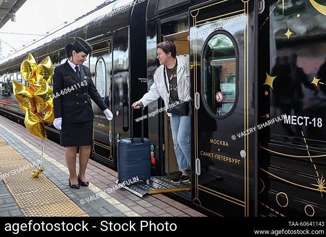 RUSSIA, MOSCOW - JULY 24, 2023: A car attendant is seen by the Night Express train running between St Petersburg and Moscow, at Leningradsky railway station