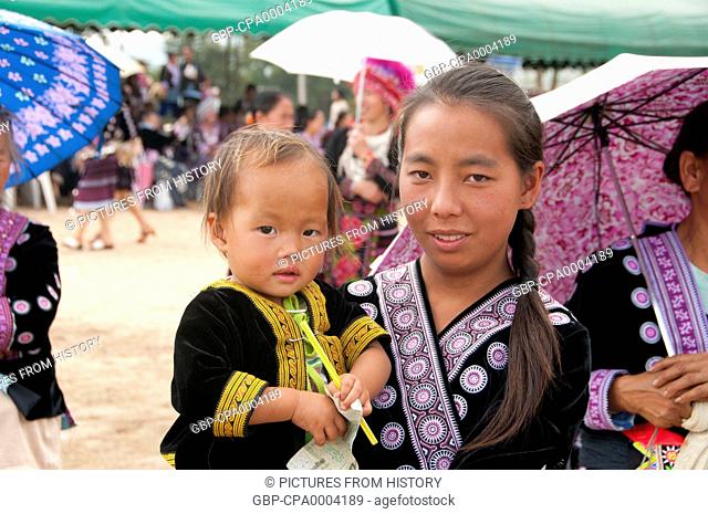 Thailand: Mother and child, Hmong New Year celebrations, Chiang Mai, Northern Thailand