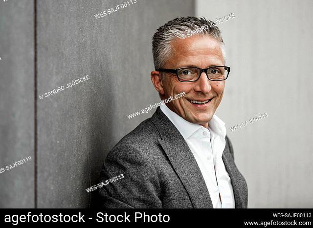 Happy male investor in balzer jacket