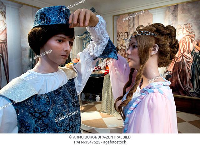 Two wax figures depicting Cinderella (R) and the prince are on display at the exhibition 'Three hazelnuts for Cinderella' at Moritzburg palace in Moritzburg