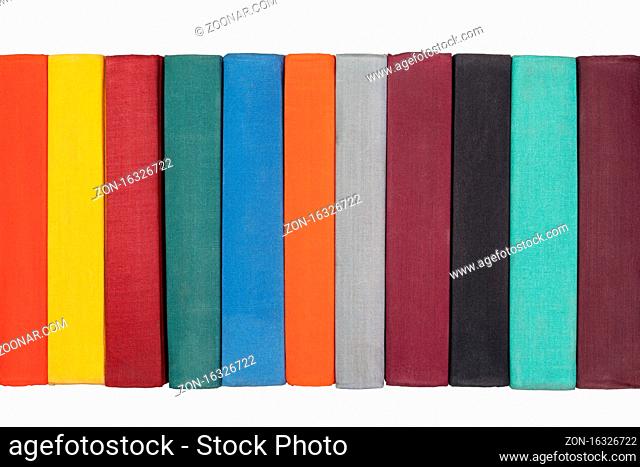 Close up view of colorful old spines vintage books. Isolated on white background