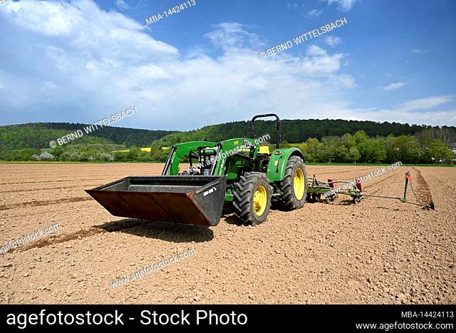 Breuberg, Odenwaldkreis, Hesse, Germany. John Deere tractor E 5055 at sowing, year of construction 2016, engine capacity 2900 cm, 55hp, 5 E-series