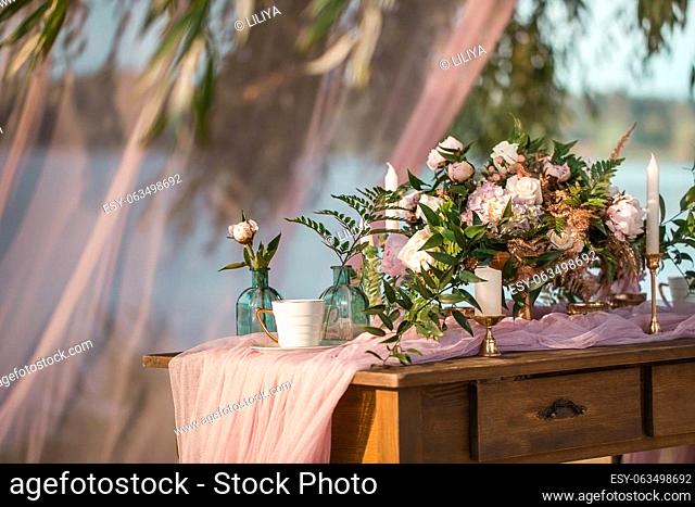 Beautiful wedding decor. Pink roses vintage style. Wedding Floristics Decoration