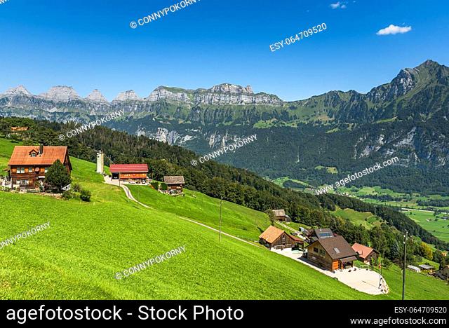 Farms on the Flumserberg, view towards the Churfirsten with Chaeserrugg, Canton St. Gallen, Switzerland