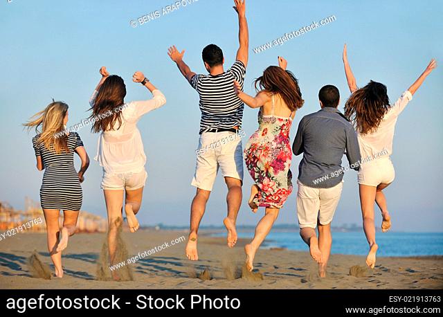 happy young people group have fun on beach