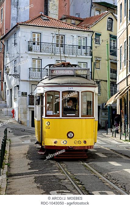 electric tram of the line 28 in the district of Alfama, Lisbon, Portugal, Europe / adhesion railway