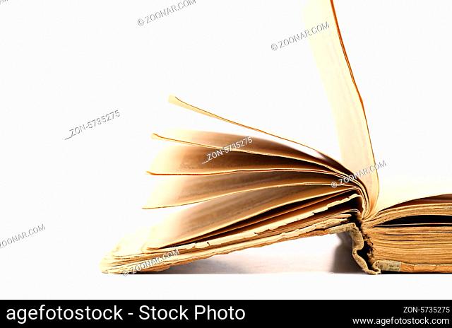 Opened old book isolated on a white background
