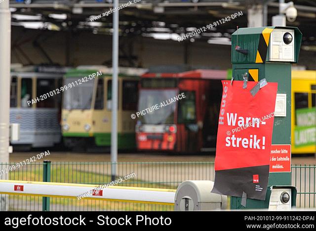 09 October 2020, Brandenburg, Brandenburg/Havel: A red poster with the inscription ""Warning strike"" is stuck at the entrance to the Brandenburg an der Havel...