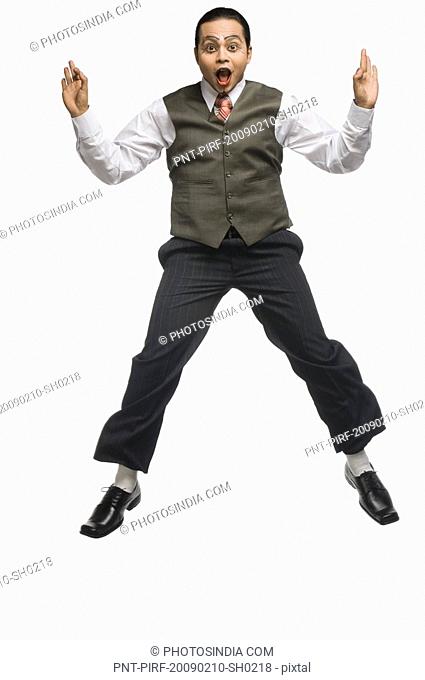 Portrait of a mime jumping