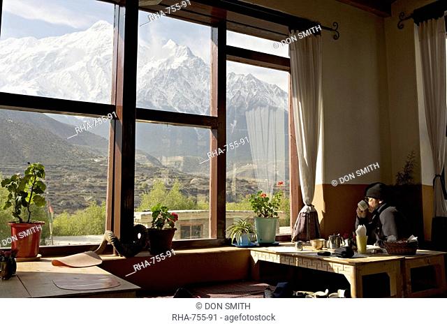 View of the Nilgiri range whilst enjoying breakfast in Om's Home hotel at Jomsom on the Annapurna circuit trek, Himalayas, Nepal, Asia