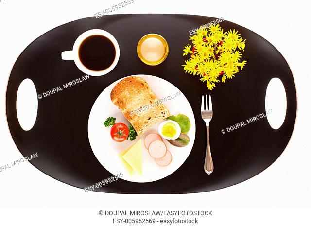 Breakfast with toast, cheese, sausage, salad, tomato, egg and cup of coffee