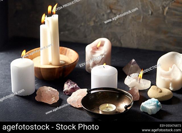 burning candles and crystals for magic ritual
