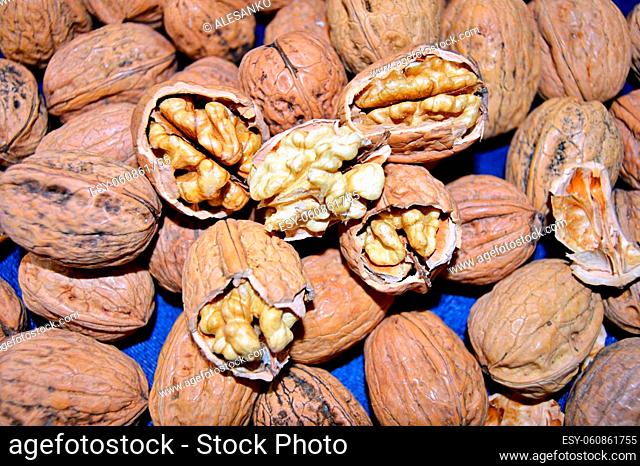 Fresh Chopped Walnut. Food background. Walnut kernels close-up. Walnuts whole in their skins, chopped, nut hulls, walnut kernels