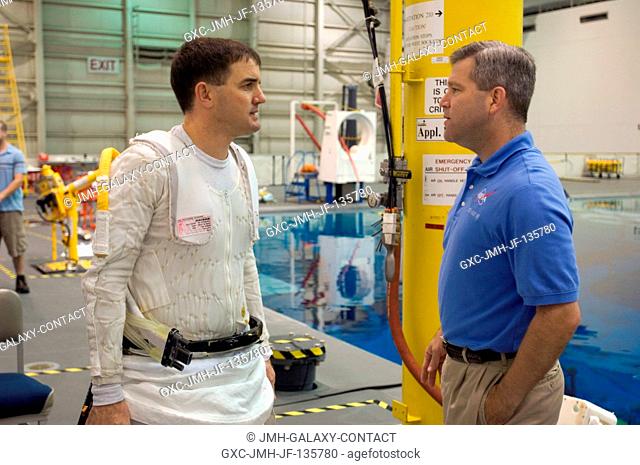 Astronauts Stephen N. Frick (right) and Rex J. Walheim, STS-122 commander and mission specialist, respectively, exchange thoughts as they prepare for a training...