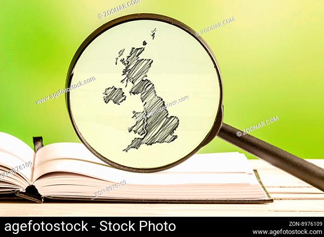 United Kingdom with a pencil drawing of a UK map in a magnifying glass