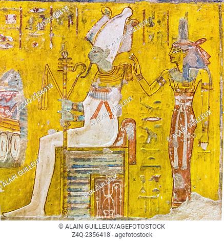 UNESCO World Heritage, Thebes in Egypt, Valley of the Nobles, tomb of Neferronpet. The god Osiris seats on a throne, wears an Atef crown and a collar with...
