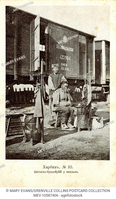 Barber at the trackside - Harbin, China - formerly Eastern Russia/Manchuria (Pinyin) - under Russian control between 1896-1924