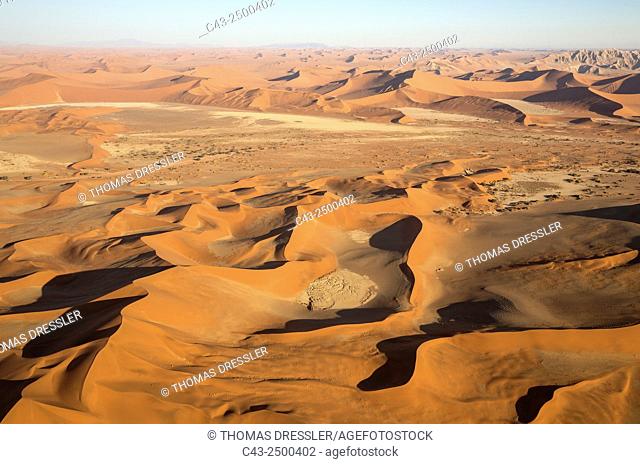 Sand dunes in the Namib Desert. Top right the Witberg (White Mountain, 426m), a granite massif in the centre of the Namib Desert