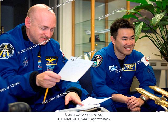 Astronauts Mark E. Kelly (left), STS-124 commander; and Akihiko Hoshide, mission specialist representing the Japan Aerospace Exploration Agency (JAXA)