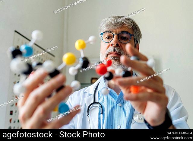 Scientist examining DNA molecule in laboratory