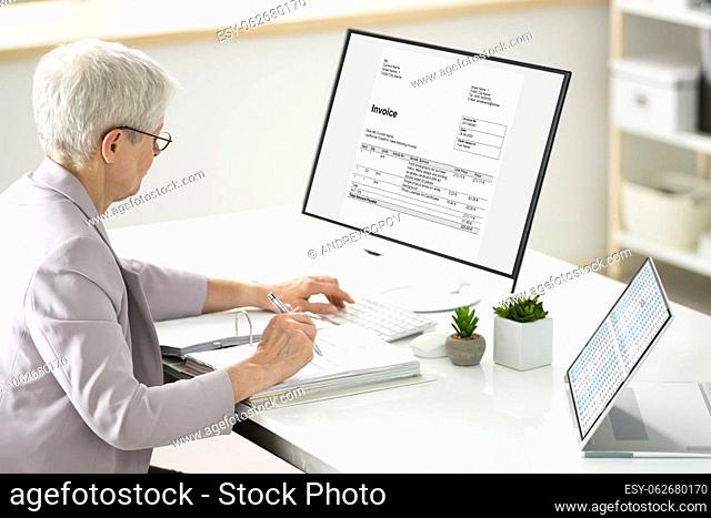 Business Accountant Calculating Tax Invoice In Office